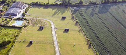 Farm fields with small huts