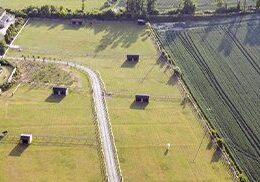 Farm fields with small huts
